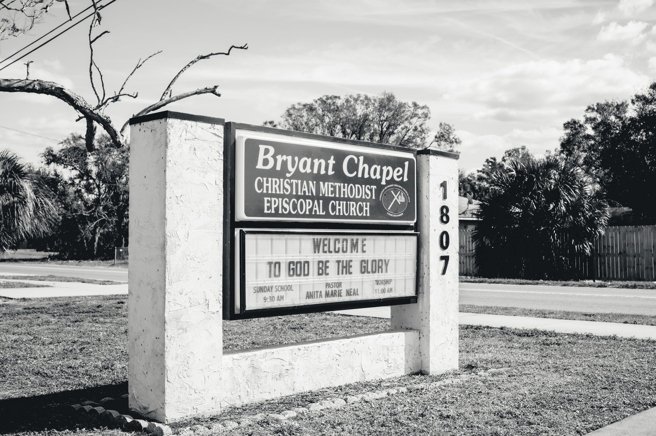 A roadside sign reading Bryant Chapel Christian Methodist Episcopal Church, 1807.