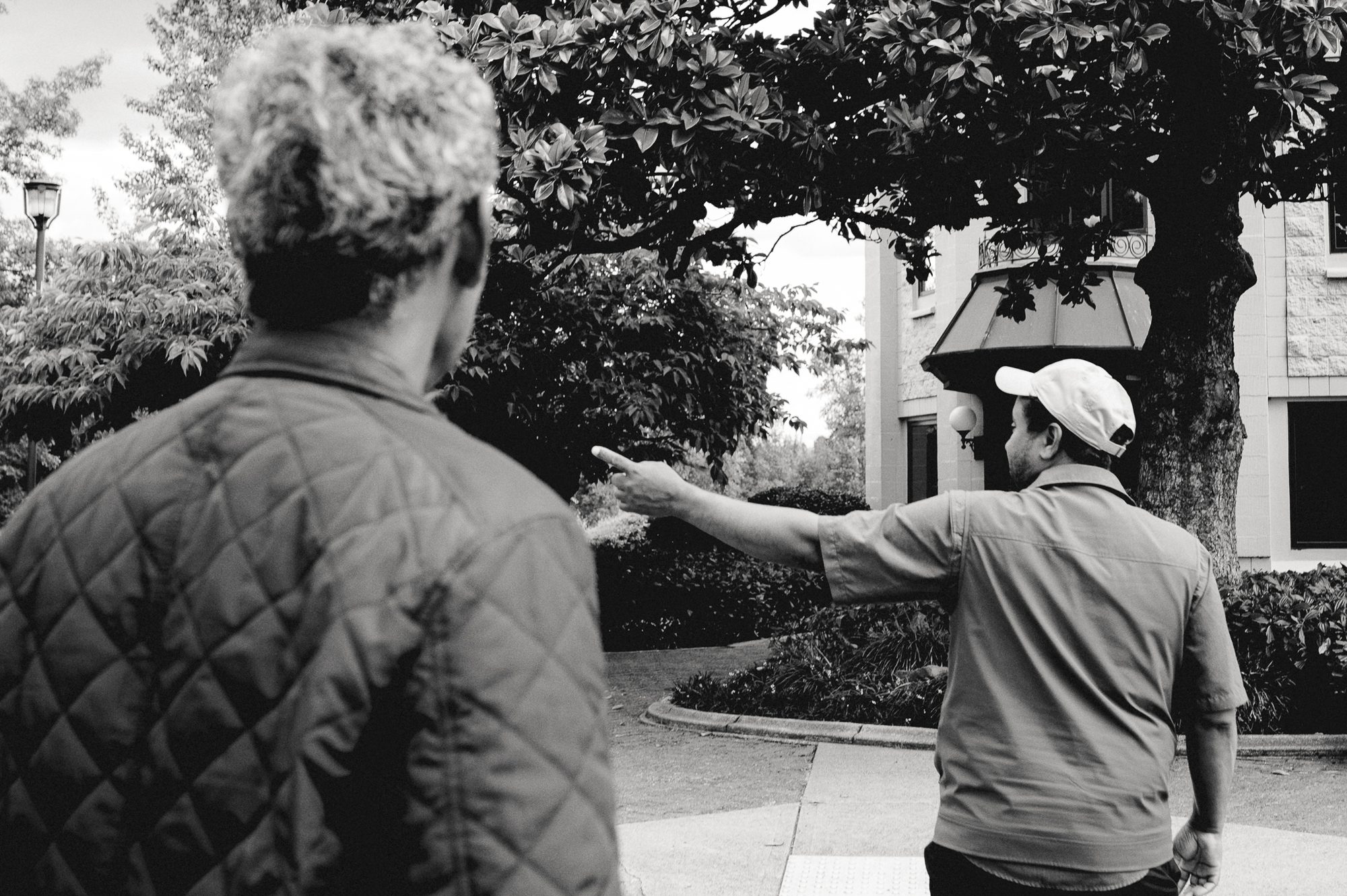 Two men seen from behind